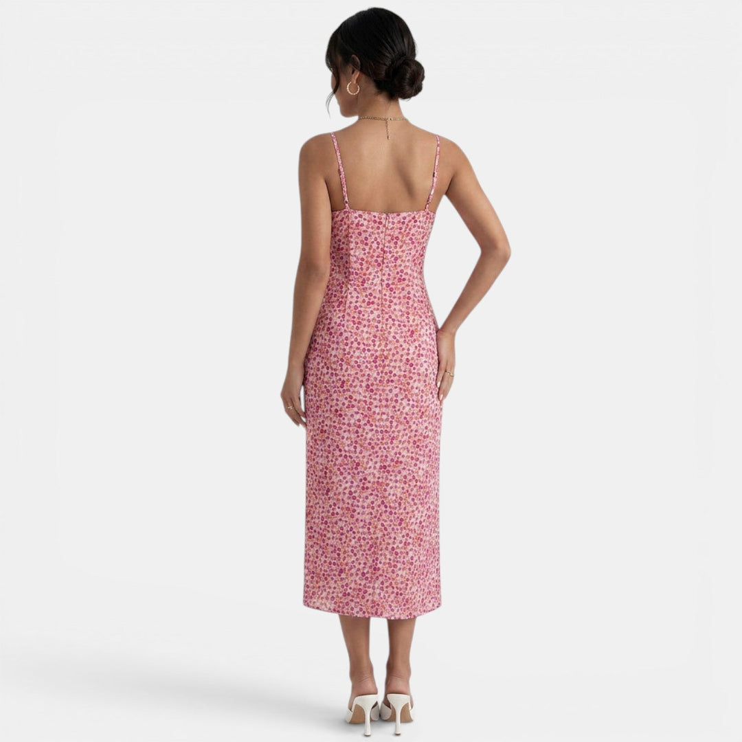 Vestido midi floral bohemio de mujer con estampado de flores rosas, corte elegante y fluido para verano/primavera.