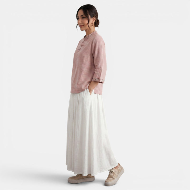 Blusa casual de algodón lino para mujer, con bordados intrincados y un toque bohemio chic.
