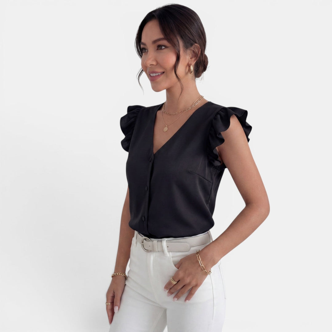 Camisa femenina con volantes y fila de botones. Estilo elegante para el día a día o eventos.