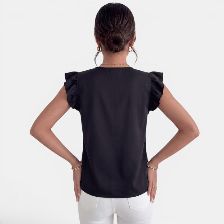 Camisa de moda para mujer, diseño con volantes y botones. Versátil para oficina o uso casual.