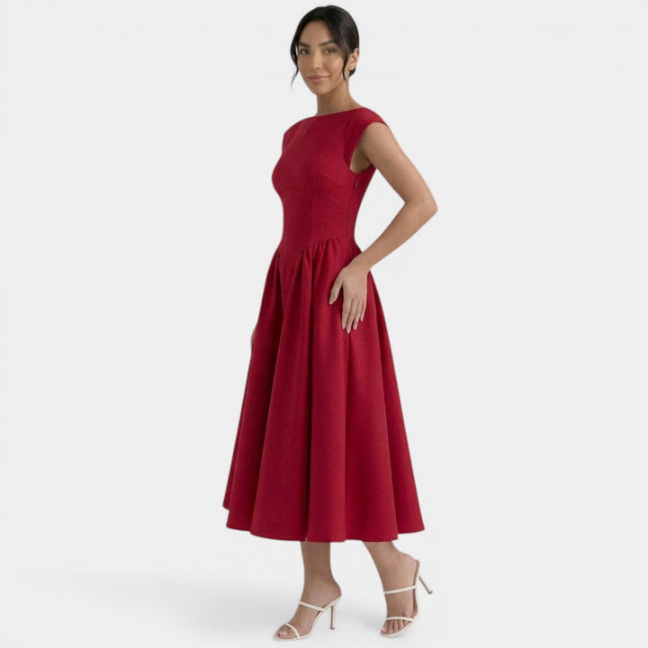 Vestido midi de mujer con cuello redondo, elegante y versátil para fiesta o look casual de verano.