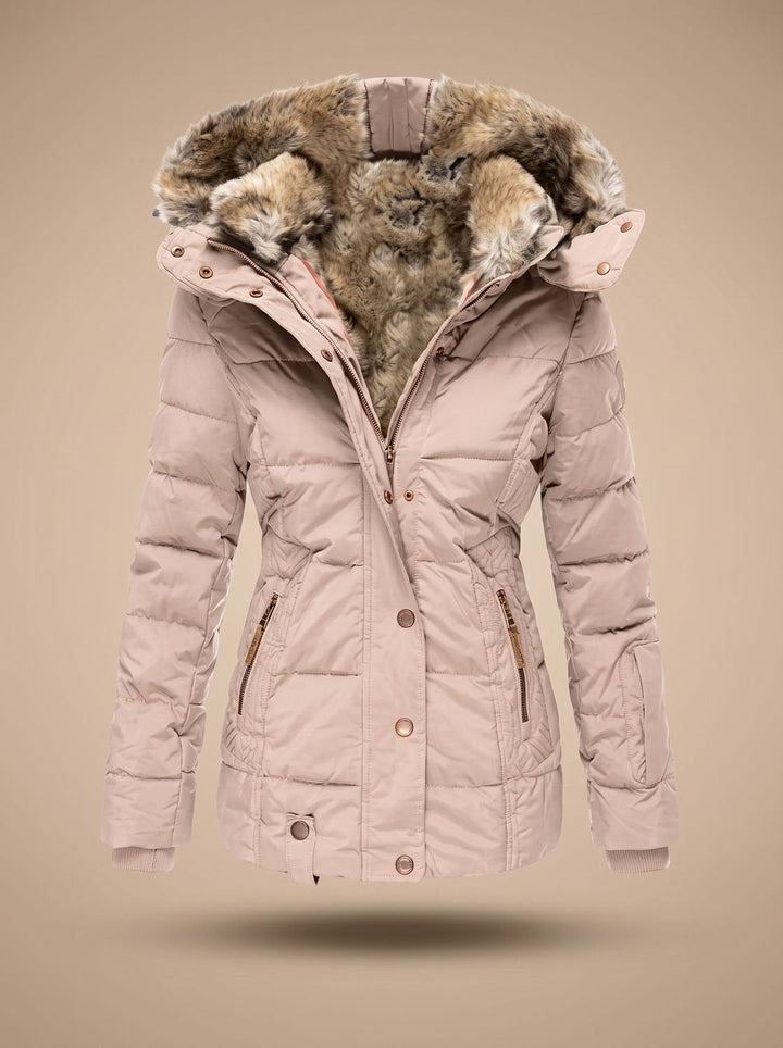 Abrigo femenino acolchado y largo, esencial para el invierno. Ofrece confort y protección contra el frío.