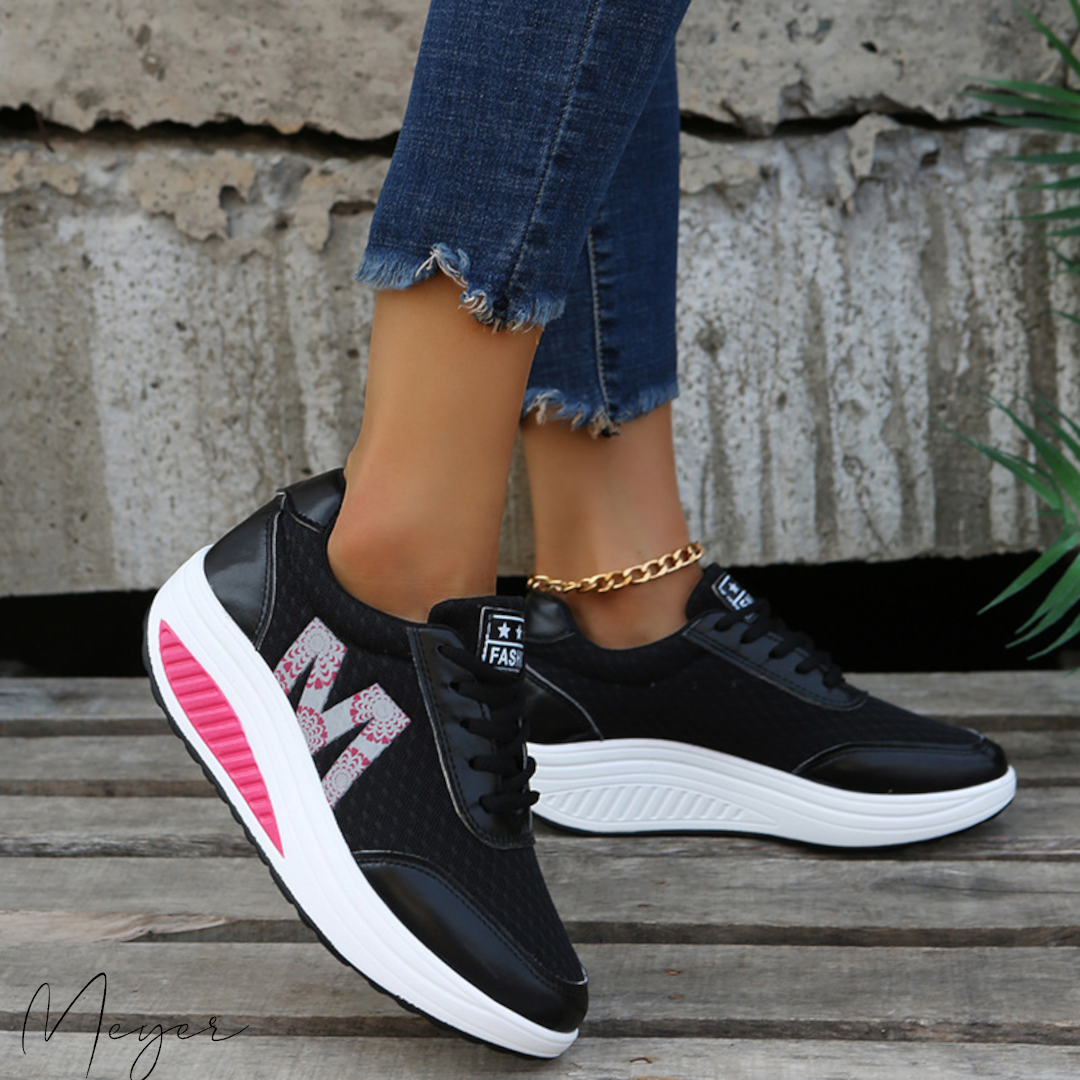 Zapatillas deportivas femeninas con tejido transpirable, amortiguación y soporte. Calzado ideal para confort y rendimiento.