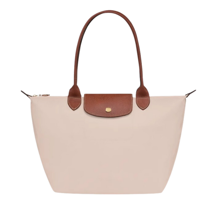 Bolso de mano con cremalleras y compartimentos, diseño funcional de nylon y piel para organizar.