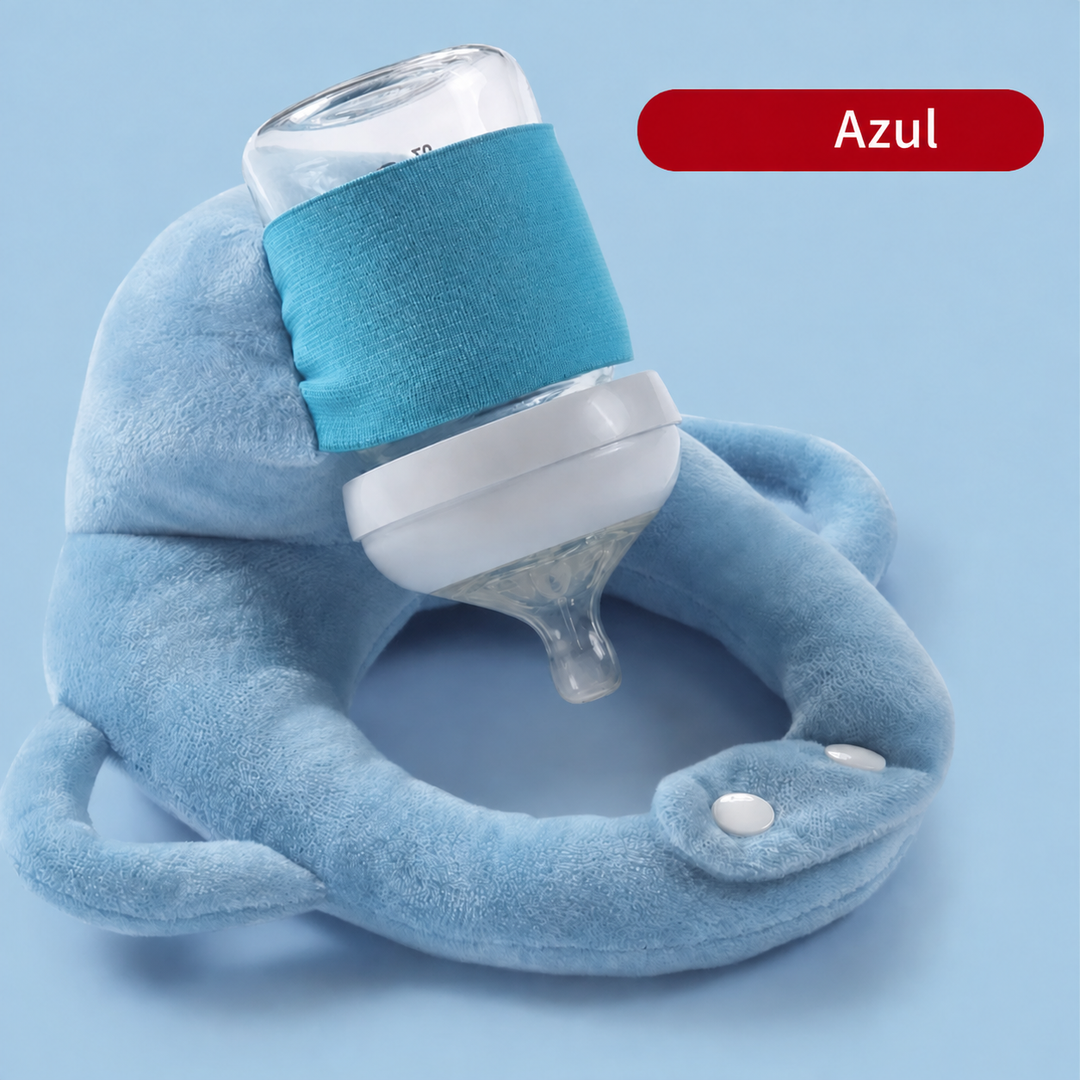 Bebé alimentándose con cojín portabiberón manos libres. Soporte ergonómico y suave para su comodidad y seguridad.
