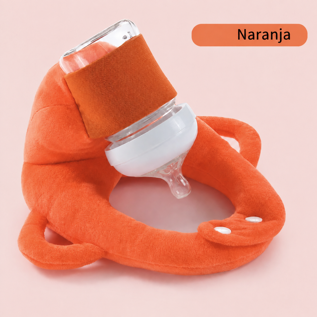 Cojín portabiberón infantil que fomenta la autonomía del bebé en la alimentación. Práctico y con soporte seguro.