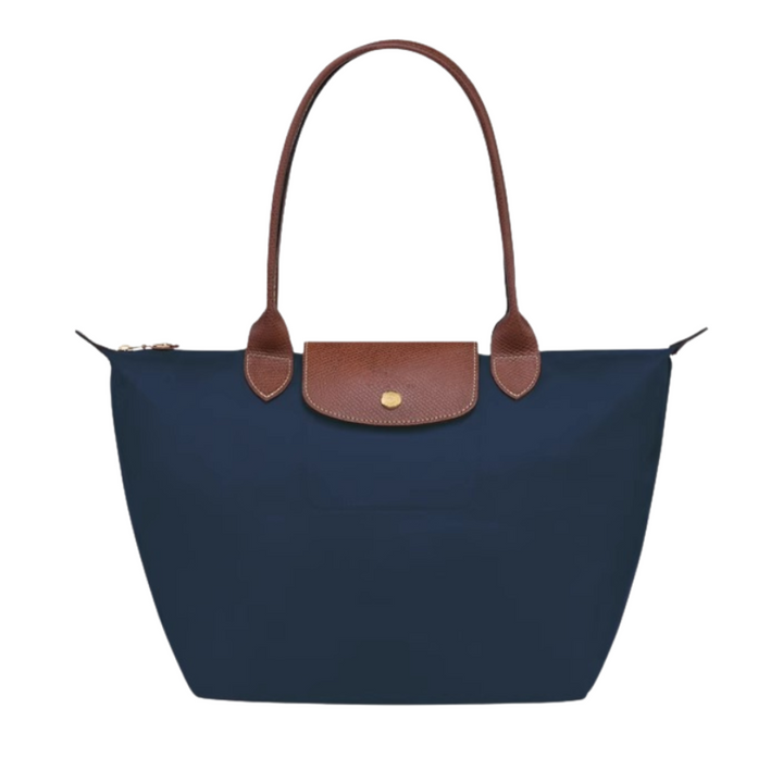 Accesorio de moda: bolso de mano nylon y piel, ideal para organizar tus esenciales con estilo.