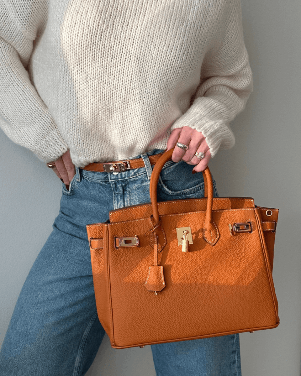 Práctico bolso de mano de piel premium para mujer con organizador inteligente. Mantén todo en orden.