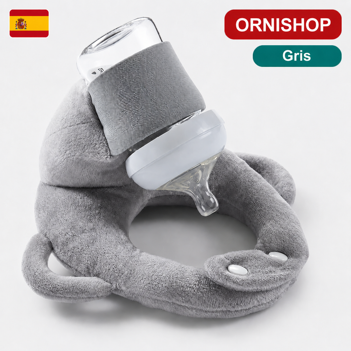 Primer plano de cojín portabiberón con biberón, mostrando su diseño ergonómico y soporte estable para el bebé.
