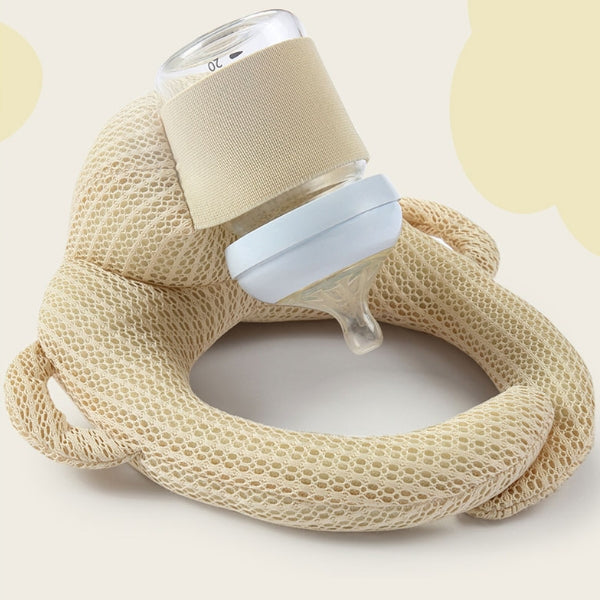 Cojín portabiberón suave y cómodo, diseñado para la alimentación autónoma del bebé. Fácil de limpiar y usar.