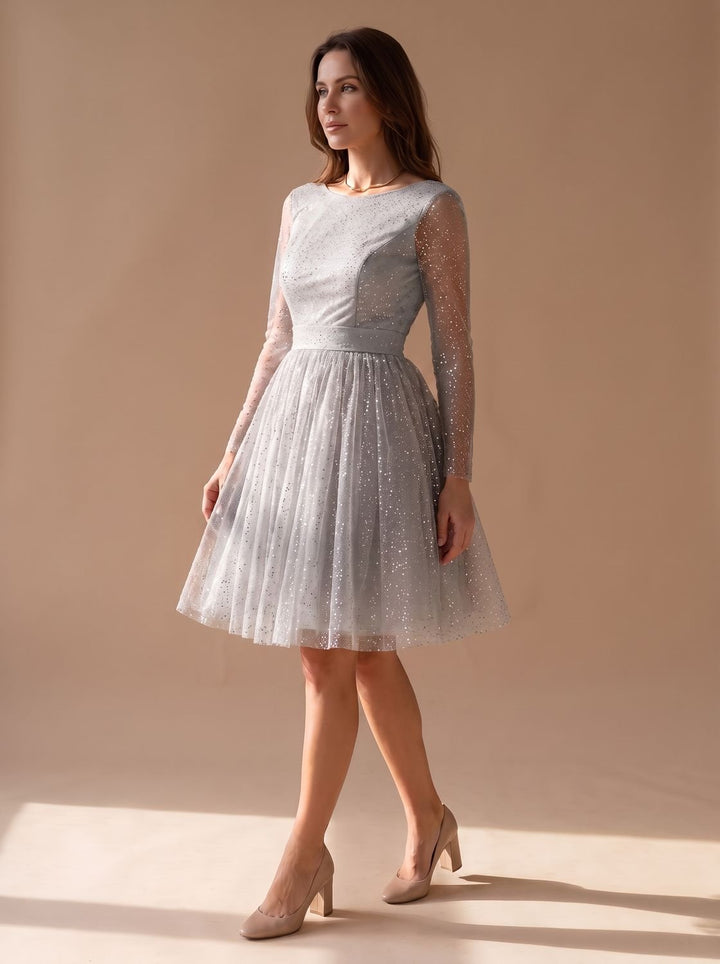 Vestido de fiesta mujer de tallas grandes con tul glitter. Manga larga evasé y corte evasé, para lucir radiante.