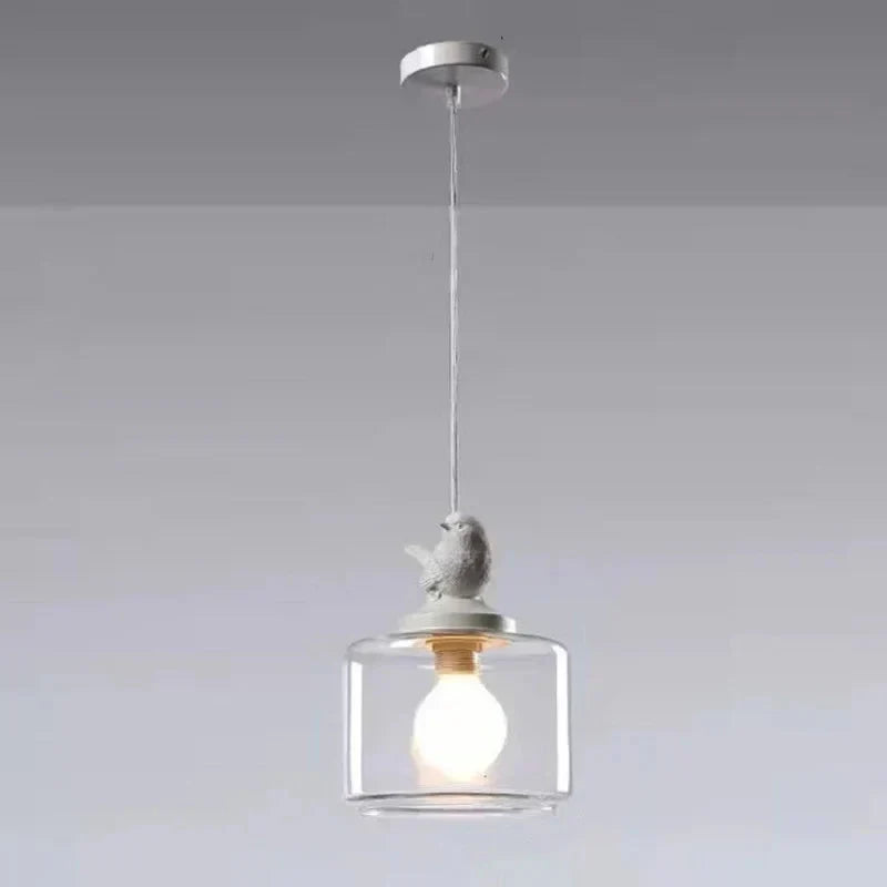 Diseño único: lámpara de techo con pájaro. Cilindro de vidrio, iluminación cálida y moderna.