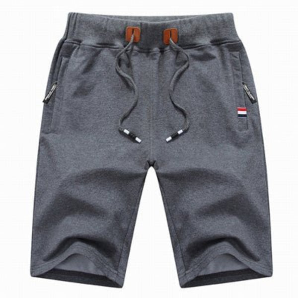 Shorts de hombre, algodón cómodo, bolsillos con cremallera, ideales para actividades deportivas de verano.