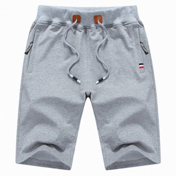 Shorts deportivos de algodón para hombre con bolsillos seguros de cremallera, versátiles y ajustables.