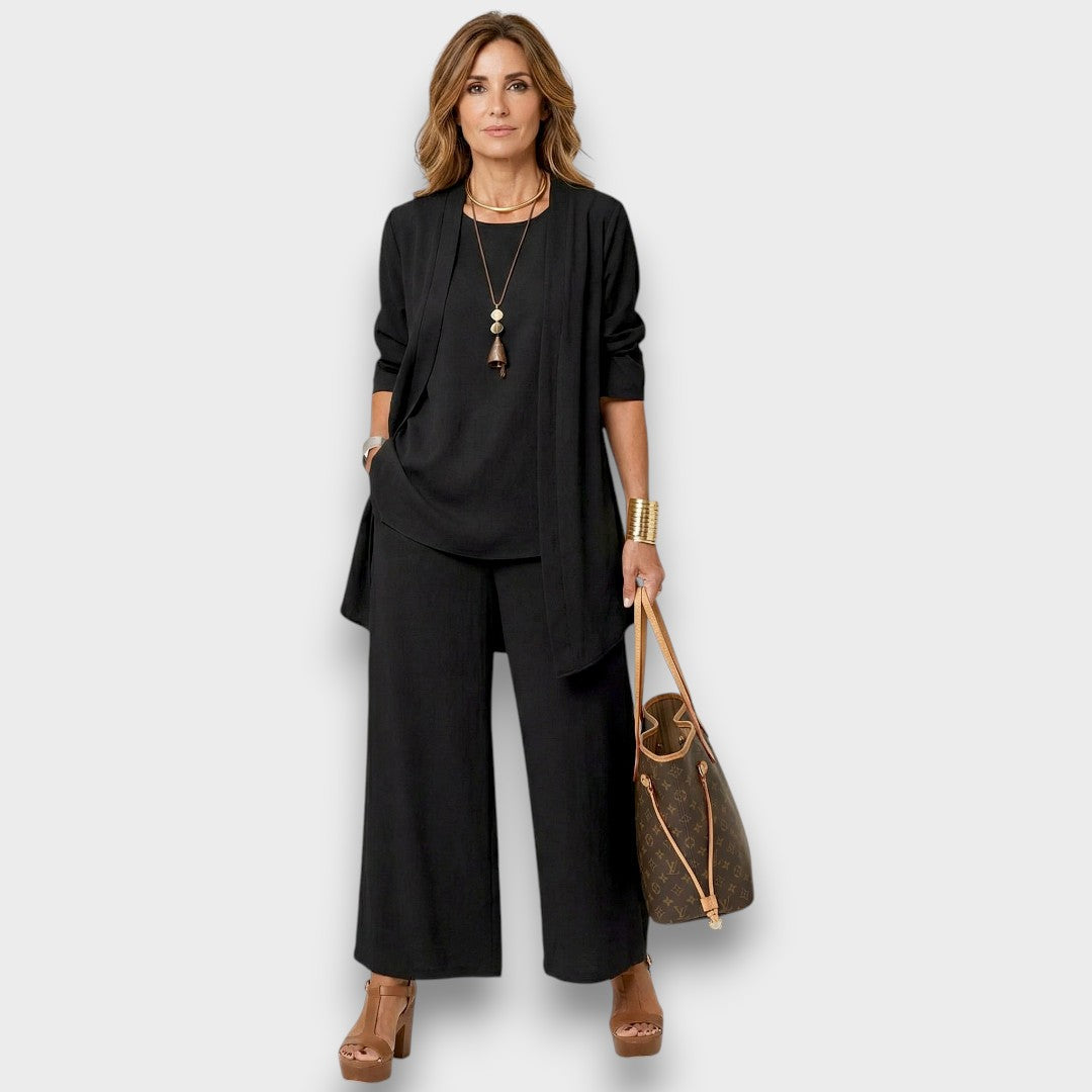Conjunto casual gris de 3 piezas para mujer con pantalón ancho, chaleco y blusa. Estilo versátil y cómodo.