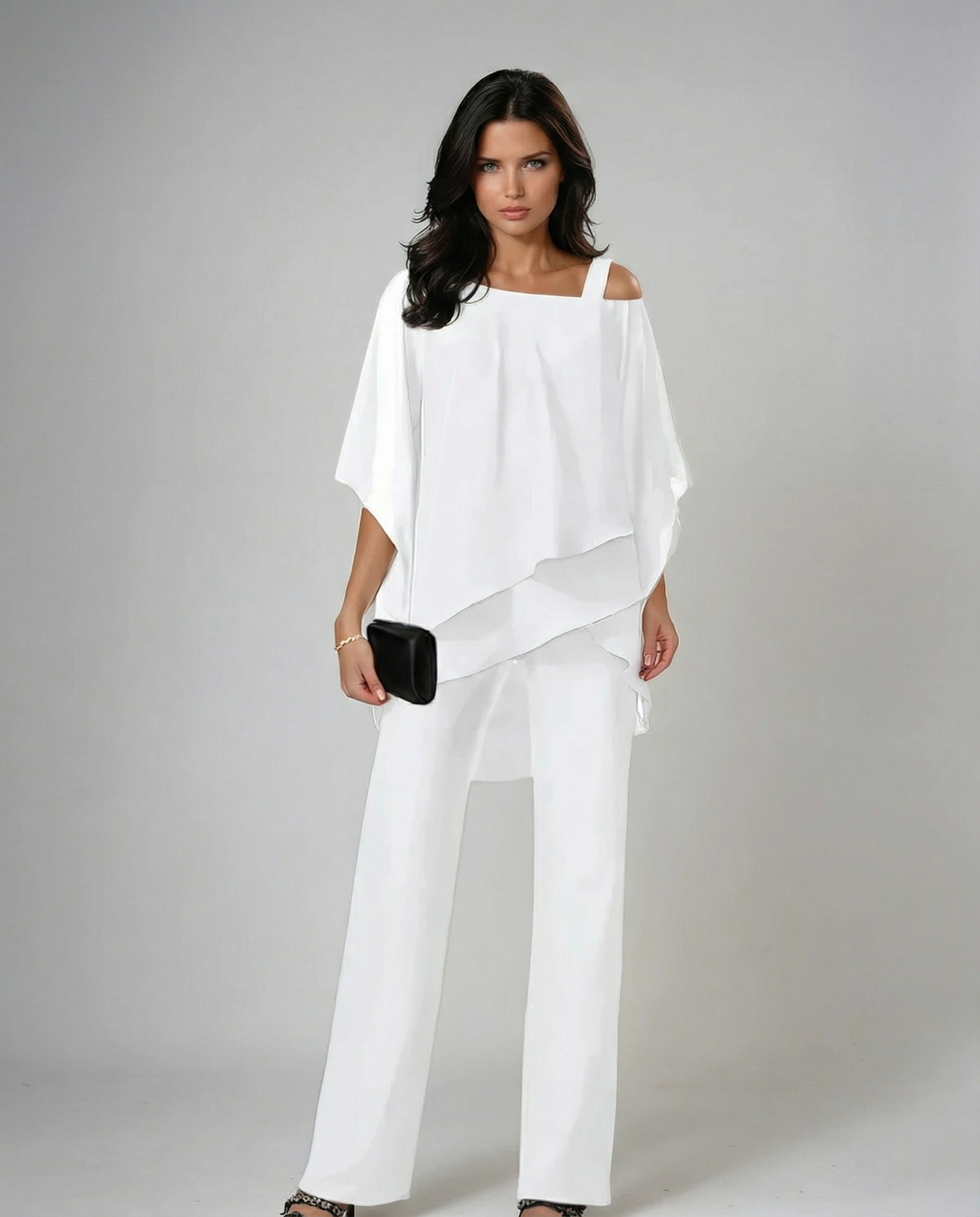 Conjunto dos piezas fluido asimétrico con pantalón ancho para mujer, estilo casual y elegante.