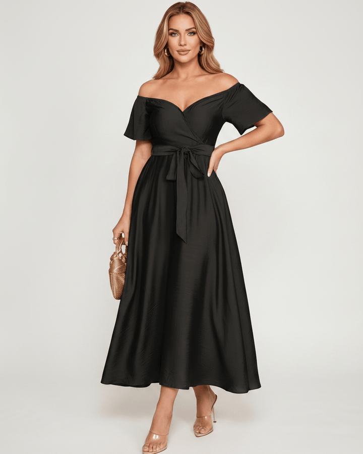 Vestido maxi de moda femenina, silueta fluida y hombros descubiertos, ideal para invitada de boda.