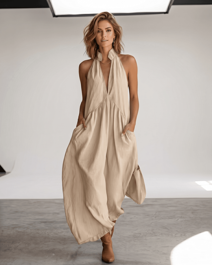Vestido de corte maxi con escote halter, ideal para la figura femenina y el confort de verano.