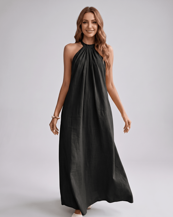 Vestido maxi halter fluido, sin mangas y cómodo, ideal para la playa.