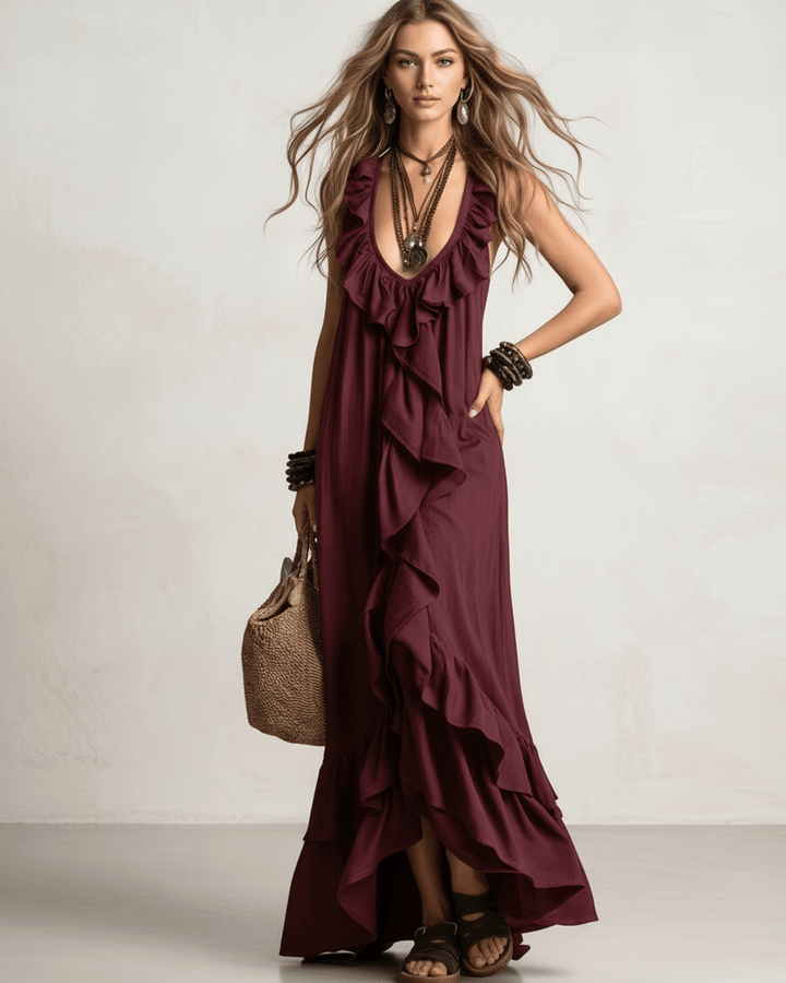 Elegante vestido maxi fluido, con volantes y escote en V, ideal para eventos de verano.