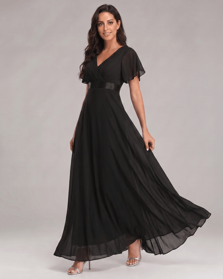 Elegante vestido maxi con escote V, mangas cortas, perfecto para eventos.