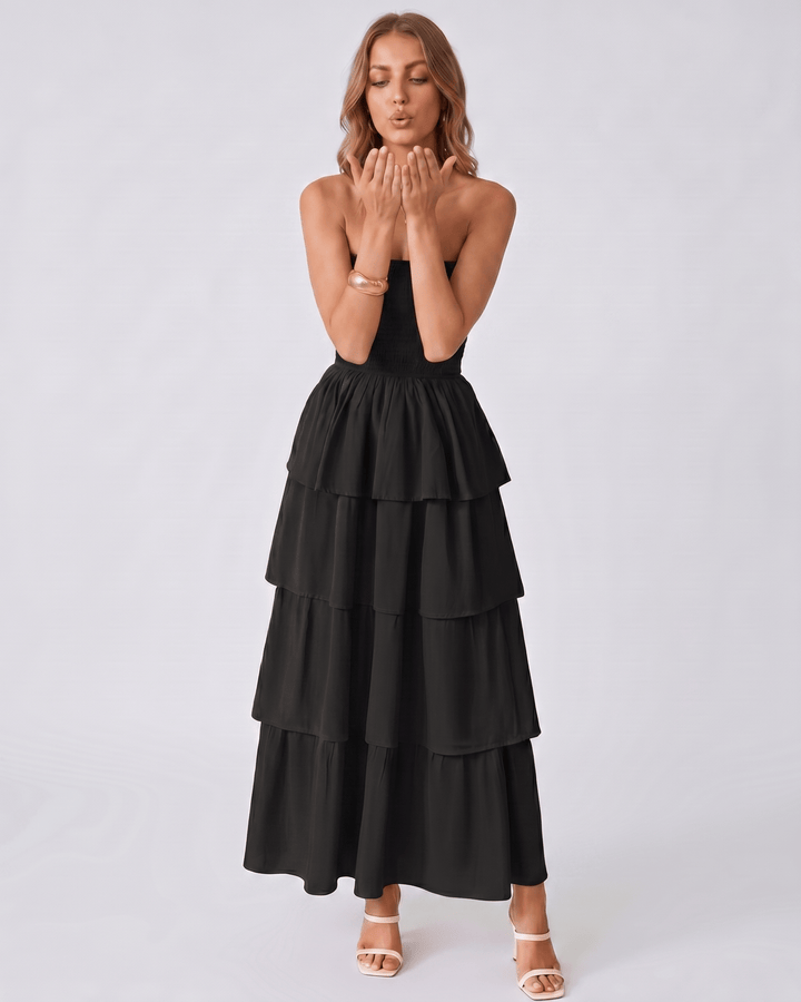 Elegante vestido maxi Solenne sin tirantes, con volantes fluidos. Ropa de fiesta ideal para verano.
