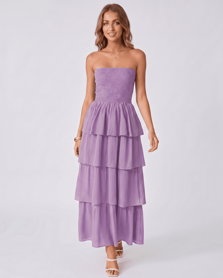 Vestido maxi Solenne sin tirantes con volantes. Versátil y chic para cócteles, bodas o cenas.