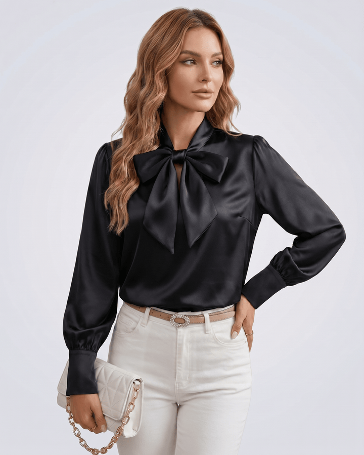 Blusa de mujer con lazada en el cuello, mangas largas, ideal para un outfit casual chic.