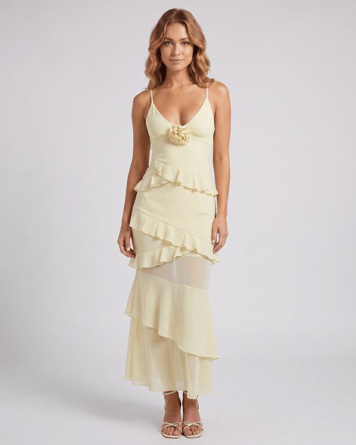 Vestido de noche azul Rosavelle, silueta sirena con volantes y delicados apliques florales. Elegante.