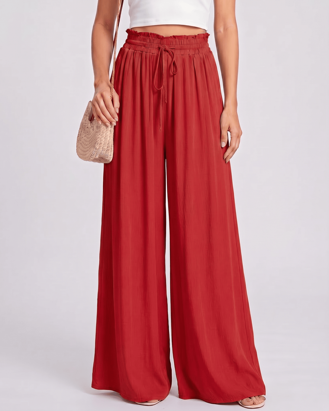 Pantalones Selene de mujer, pierna ancha, cintura alta, ideales para relajarse con elegancia en verano.