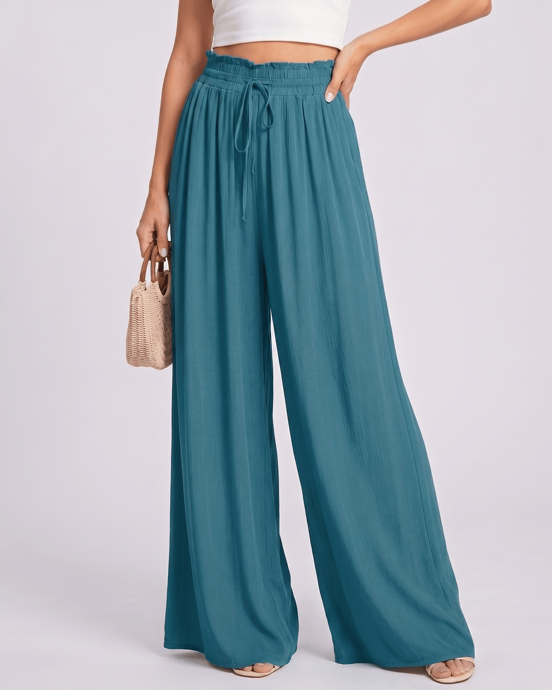 Pantalones de mujer Selene, pierna ancha, cintura alta, diseño fluido para el verano.