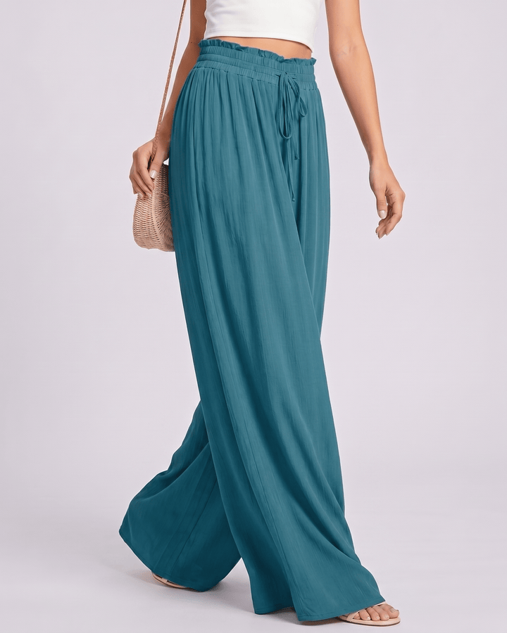 Pantalones Selene de mujer, corte pierna ancha, cintura alta, ideales para días de verano.