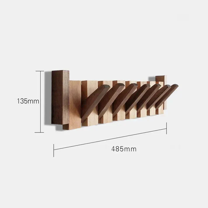 Perchero de pared estilo piano, mueble funcional para abrigos y accesorios en entradas modernas.
