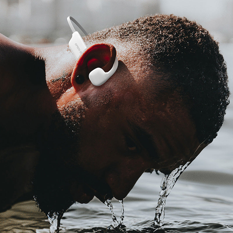Disfruta tu música con auriculares deportivos Bluetooth V5.2, impermeables y con manos libres.