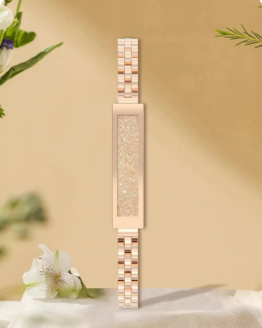 Elegante brazalete inteligente para mujer en tono oro/plata, un accesorio de moda con funciones de reloj y bienestar.