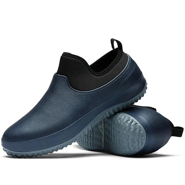 Suela antideslizante de zapatos de trabajo unisex impermeables sin cordones. Ofrece seguridad y confort duradero en el trabajo.