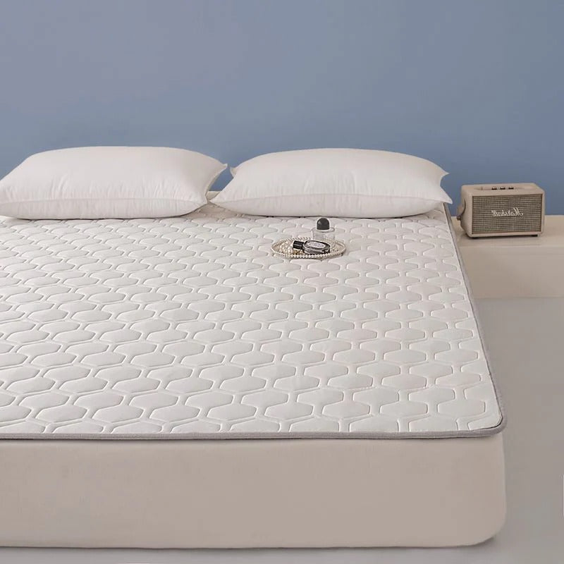 Protector refrigerante para colchón que reduce el calor, ideal para un dormitorio fresco y reparador.