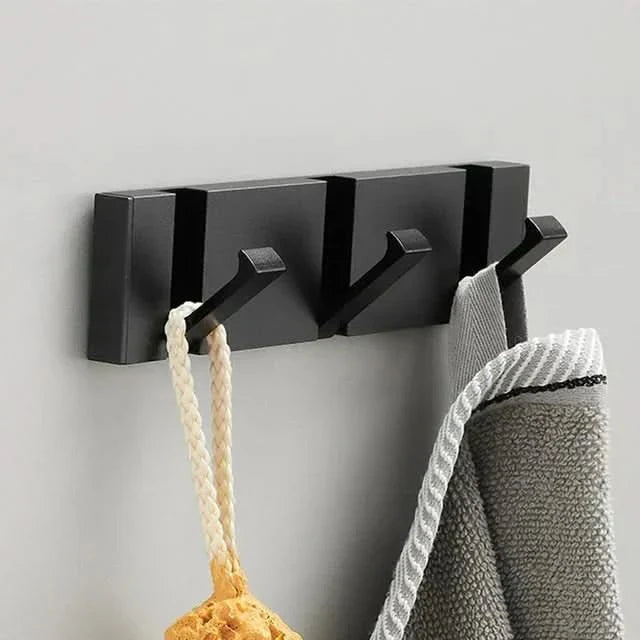 Gancho adhesivo para pared. Diseño moderno para colgar abrigos y accesorios.