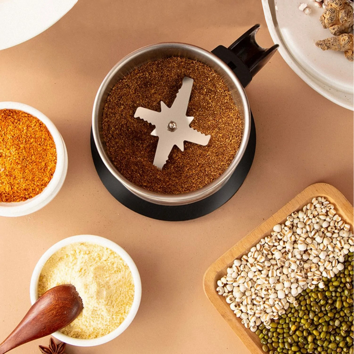 Molino de café y especias eléctrico, diseño portátil de acero inoxidable. Muele granos frescos en tu cocina.