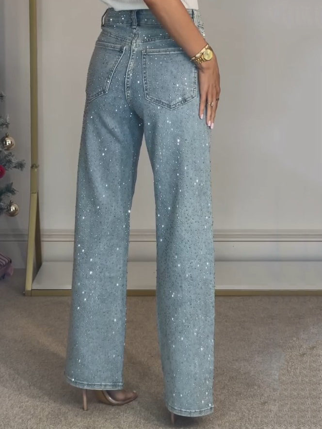 Pantalones vaqueros brillantes de mujer. Diseño de cintura alta que realza la figura, ideal para moda con estilo y confort.