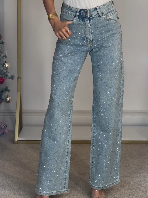 Vaqueros brillantes de mujer con cintura alta, estilo moderno para lucir glamour y comodidad en cualquier ocasión.