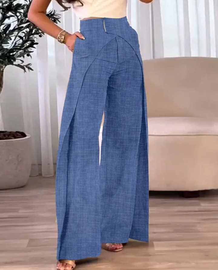 Pantalón fluido de mujer talle alto con abertura. Prenda cómoda, elegante y moderna para ropa femenina.