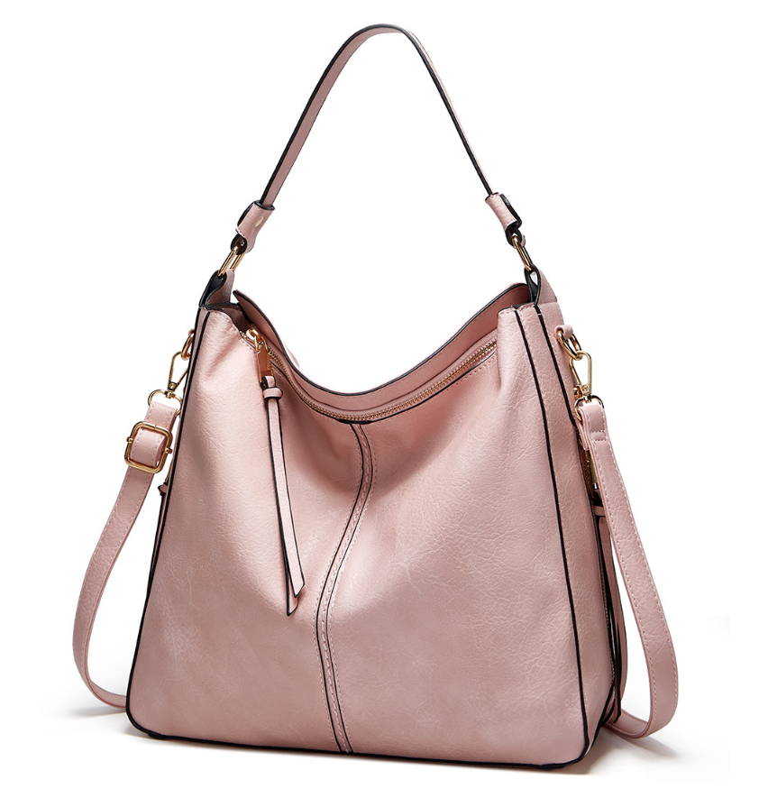 Dos bolsos para mujer: bandolera práctica y muñequera compacta, estilo y funcionalidad.