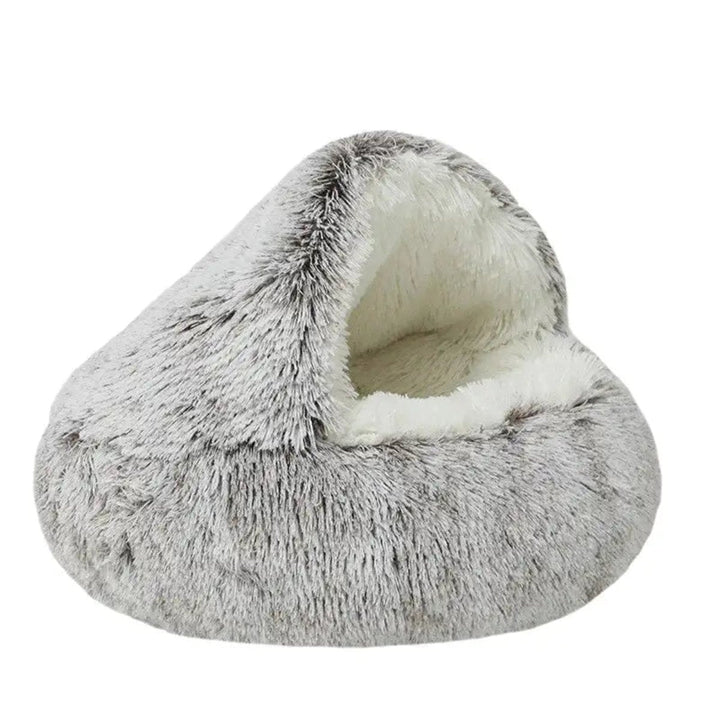 Cama nido calmante para perros y gatos. Reduce ansiedad, brinda confort suave y seguridad profunda.