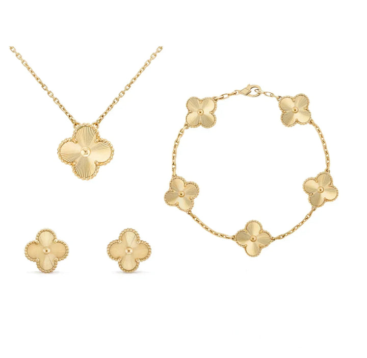 Joyería femenina con trébol: collar, pulsera y pendientes. Acero inoxidable bañado en oro 18k. Moda actual.