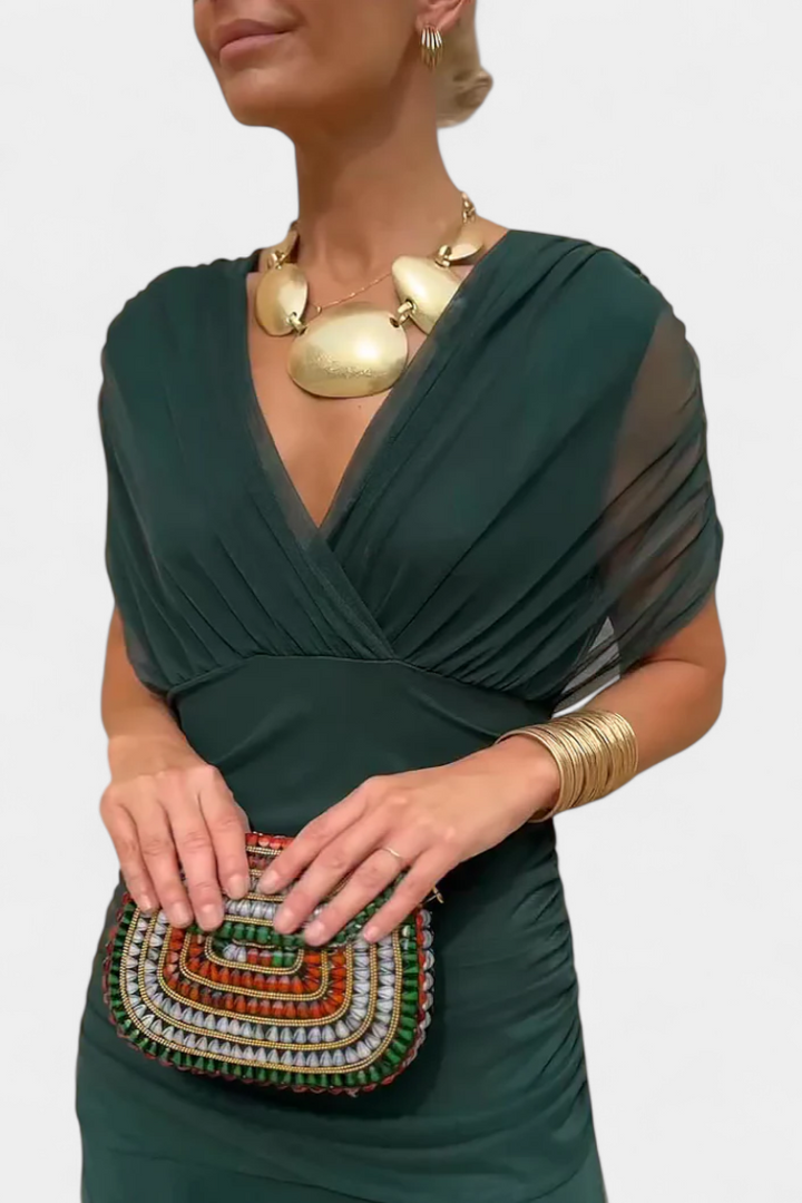 Vestido largo de fiesta elegante y fluido para mujer, con un diseño sofisticado y favorecedor escote en V.