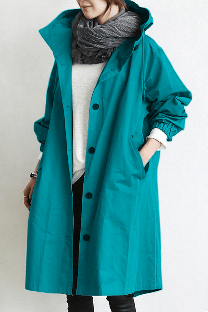 Trench impermeable de mujer, con capucha y cinturón, ropa de lluvia para un look sofisticado de otoño.