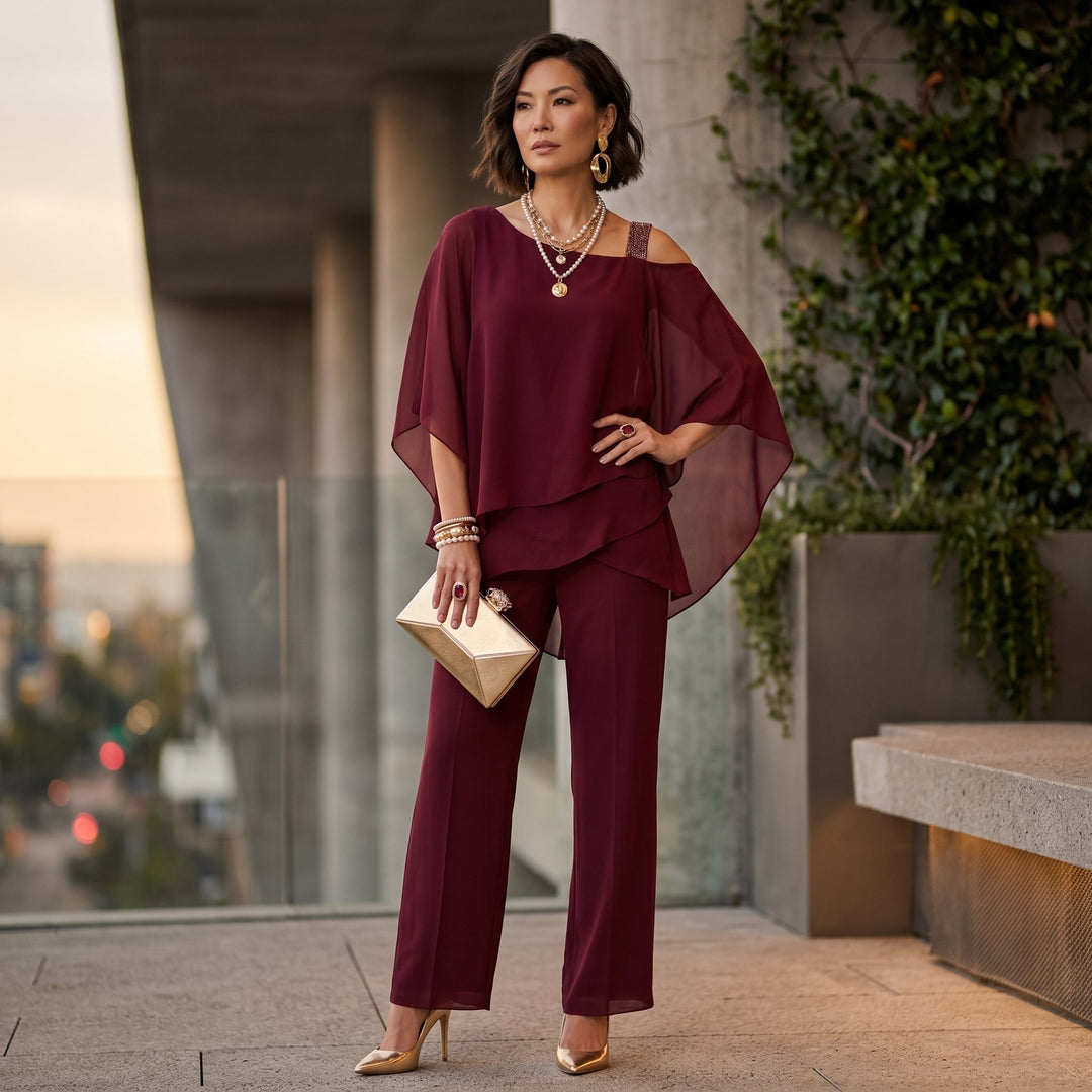 Conjunto de pantalón y blusa de gasa, elegante y asimétrico, perfecto para invitadas de boda.
