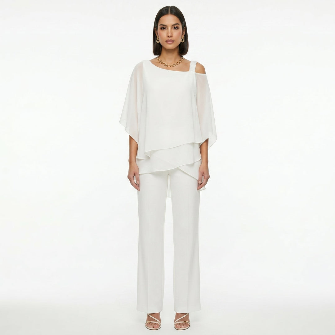 Diseño de conjunto de mujer en gasa, corte asimétrico y pantalón fluido para eventos formales.