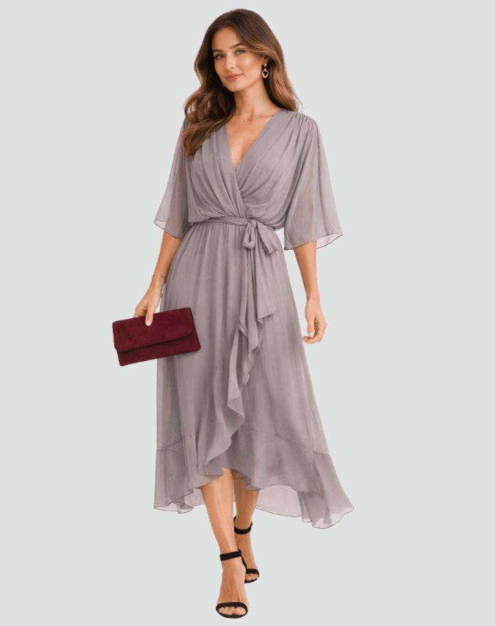 Vestido midi elegante para mujer, fluido con lazo, ideal para fiesta o ceremonia.
